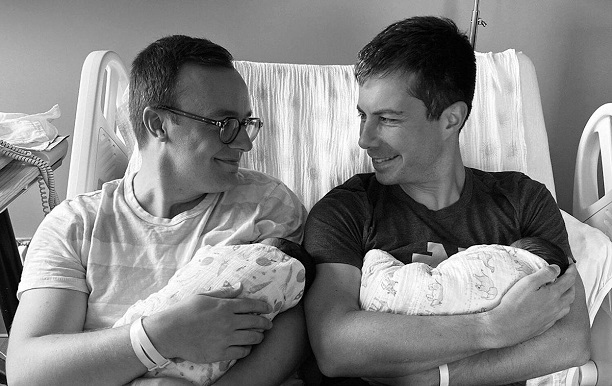 Buttigieg with baby in hospital bed