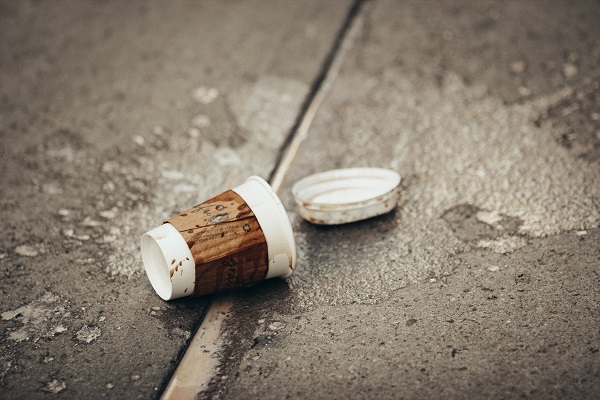spilled coffee paper cup Photo by Jon Tyson on Unsplash