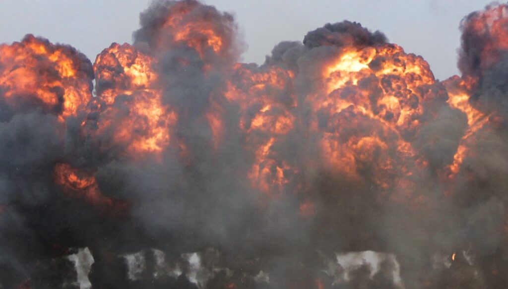 explosion fire bomb war original Photo by Chandler Cruttenden on Unsplash
