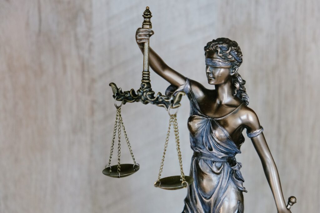 scales of justice lady justice justice blind Photo by Tingey Injury Law Firm on Unsplash