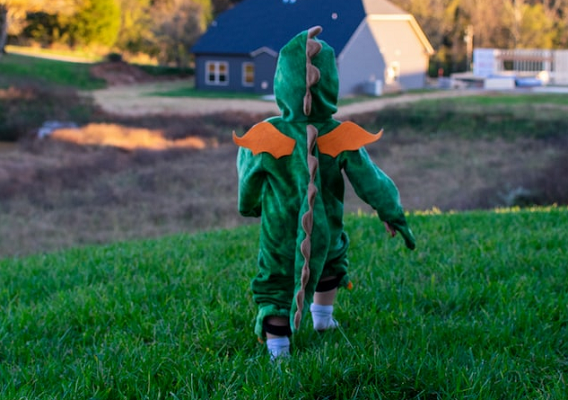 toddler dinosaur walking yard