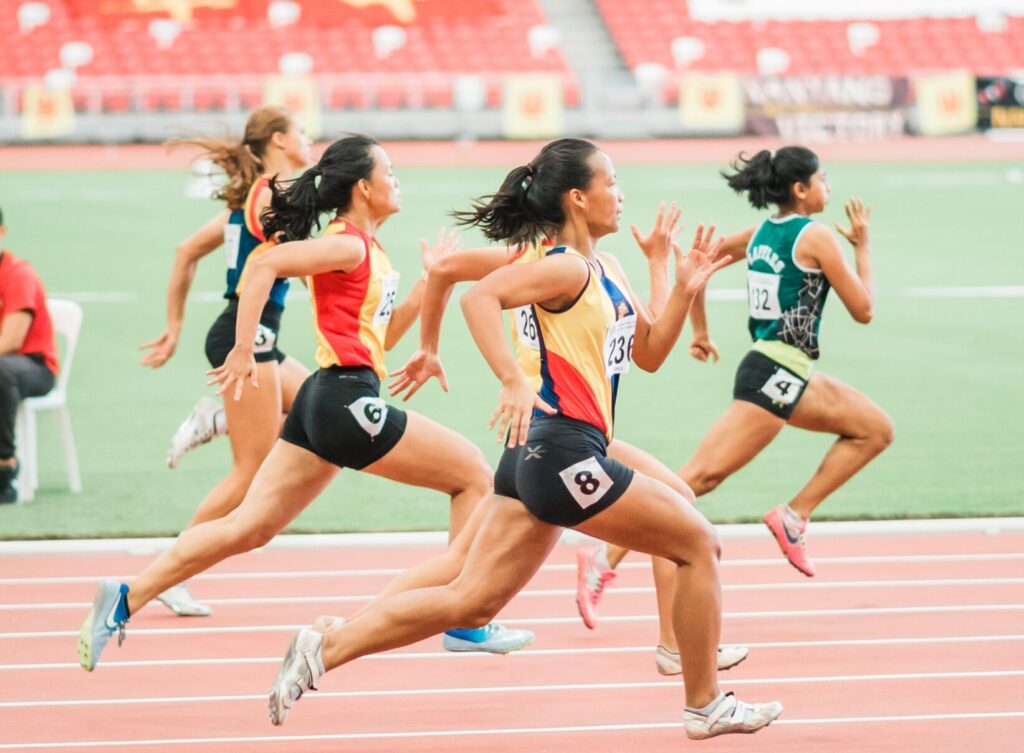 women track race athletics sports Photo by Jonathan Chng on Unsplash