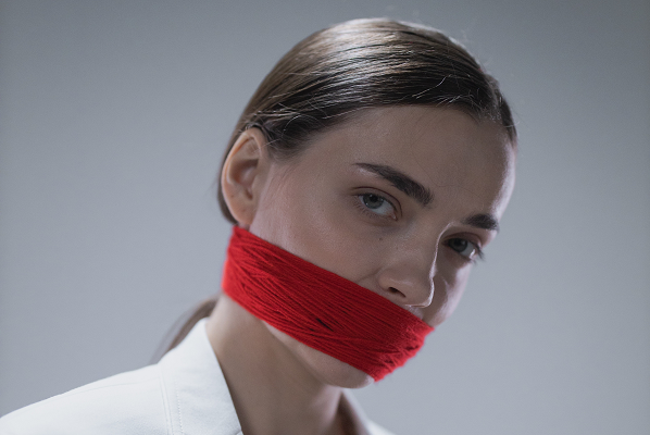 gagged free speech woman Photo by cottonbro studio pexels photoa-woman-in-white-coat-with-gagged-mouth-7670371